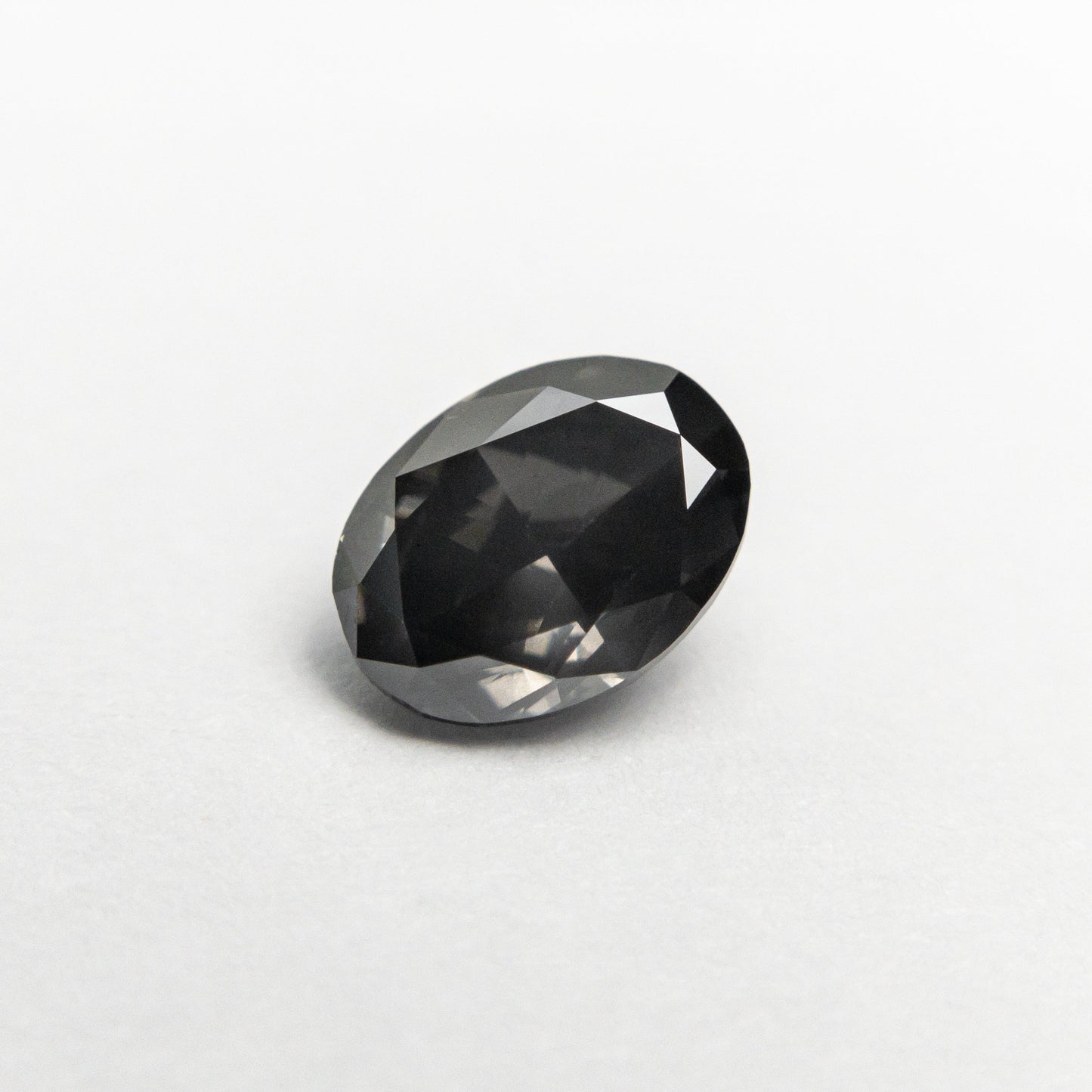 0.70ct 6.42x4.78x2.96mm SI1 Fancy Dark Grey Oval Brilliant 19923-12