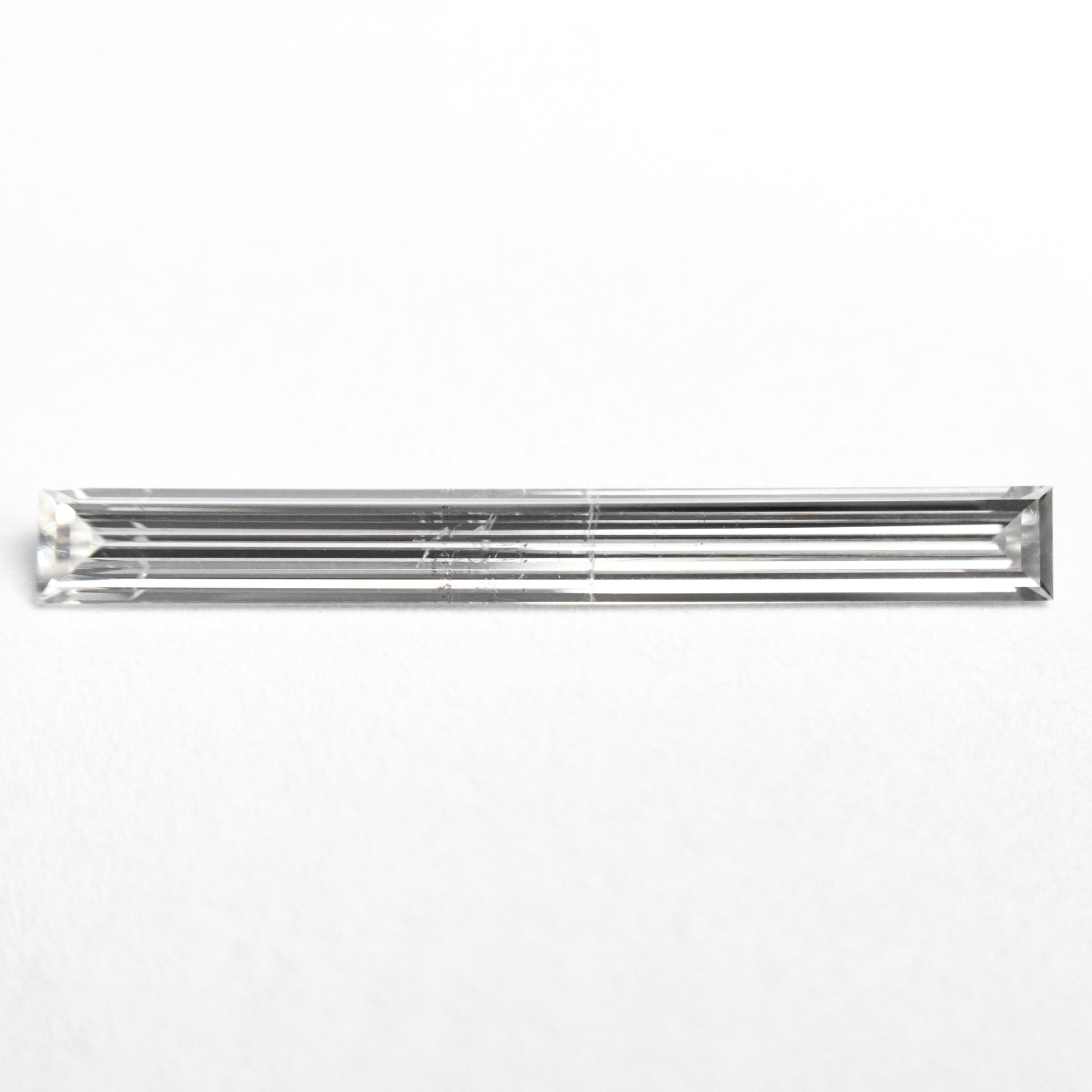 0.52ct 19.44x2.17x1.09mm SI2 E Baguette Step Cut 26545-01