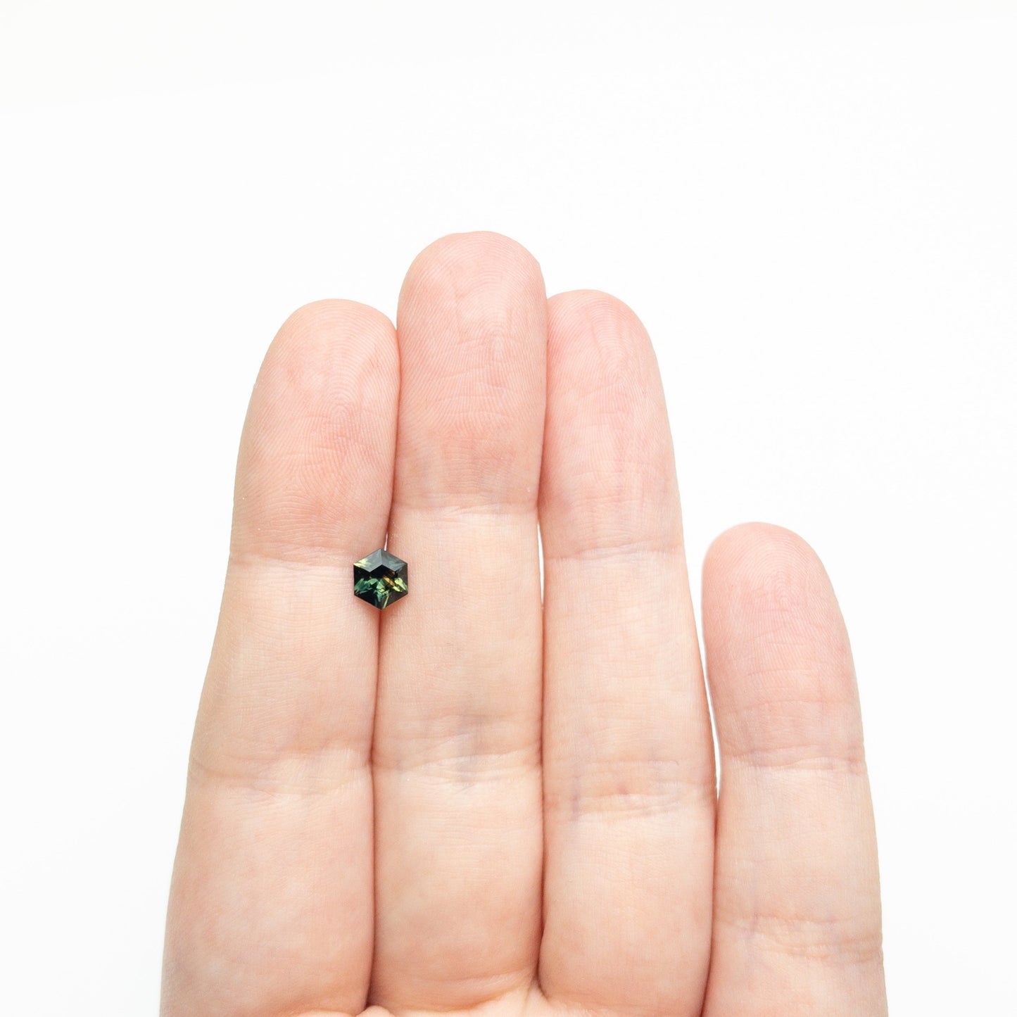 0.71ct 6.01x5.22x3.20mm Hexagon Step Cut Sapphire 27336-06